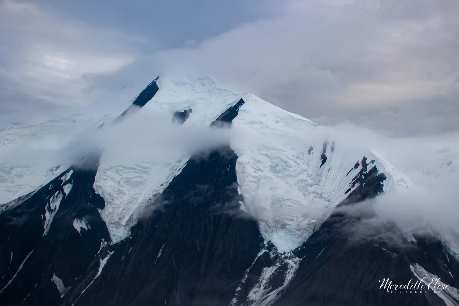 Snow-capped glaciated peaks of the Alaska Range wrapped in low cloud — Denali Alaska fine art print