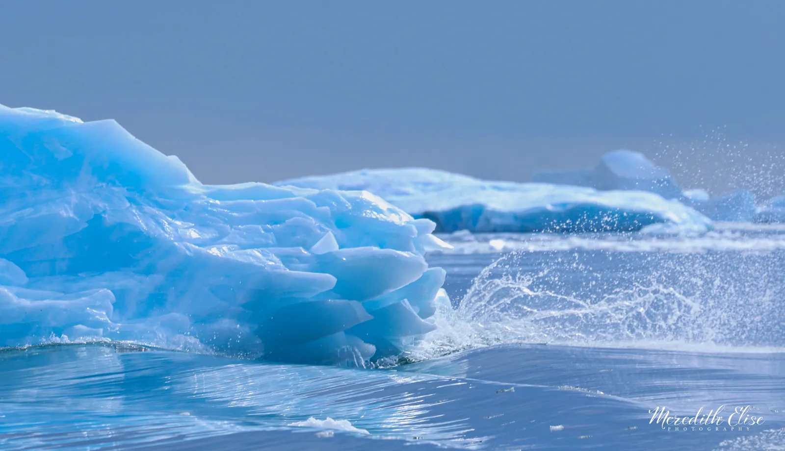 Vivid blue glacial ice tumbling through polar waves — Antarctica fine art print
