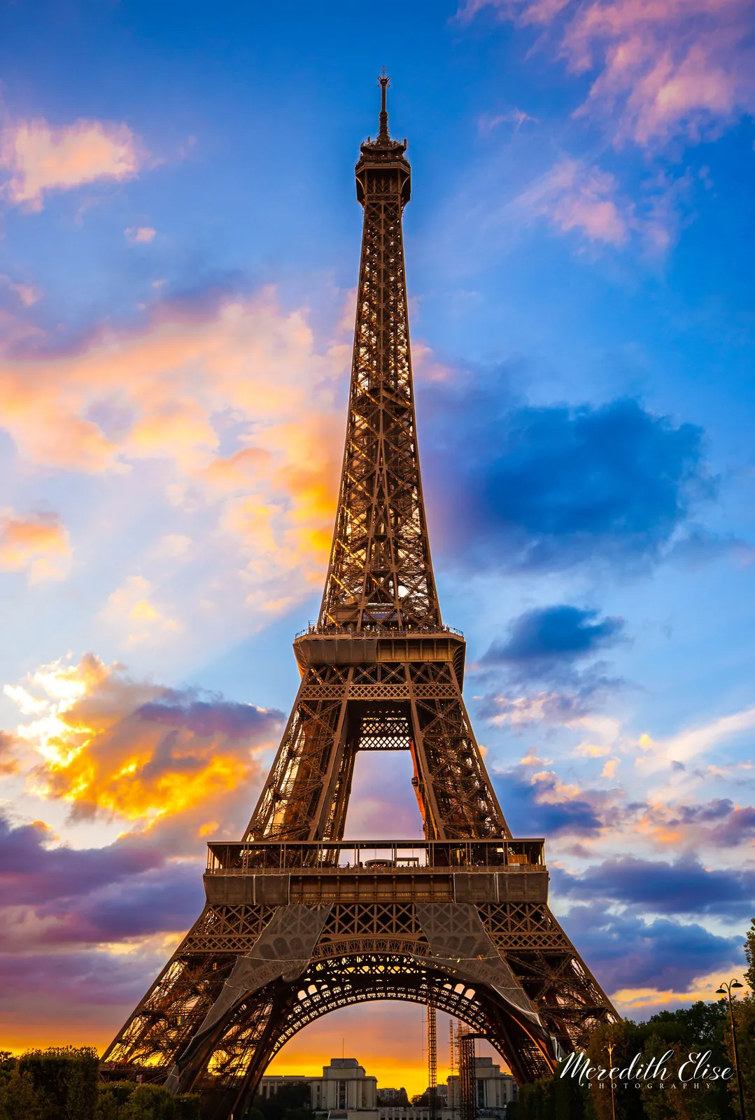 Eiffel Tower rising into a dramatic blue and gold sunset sky — Paris France fine art print